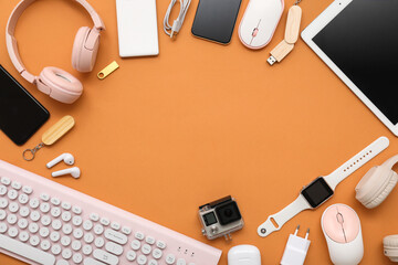 Wall Mural - frame made of different modern gadgets on color background