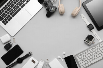 Wall Mural - frame made of modern gadgets on grey background