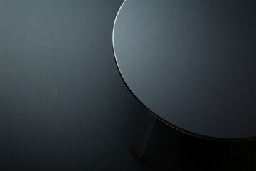Fototapete - Sleek Modern Dark Grey Round Table Top on a Dark Background