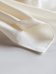 Fototapete - Close-Up of Smooth Elegant Beige Fabric with Soft Folds on a Neutral Background : Generative AI