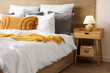 © Pixel-Shot - Interior of stylish bedroom with cozy bed and lamp on bedside table