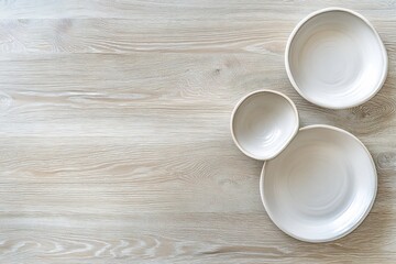 Wall Mural - Elegant Ceramic Bowls and Plates on Wooden Table