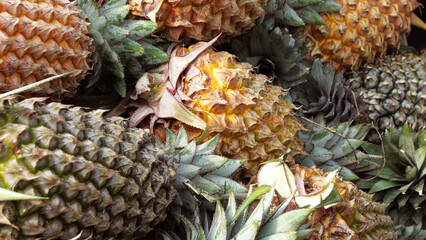 Fresh pineapple displayed in a fruit stall