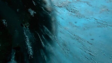 Poster - abstract view of glacial ice textures and shadows underwater with turquoise hues, suitable for creative background