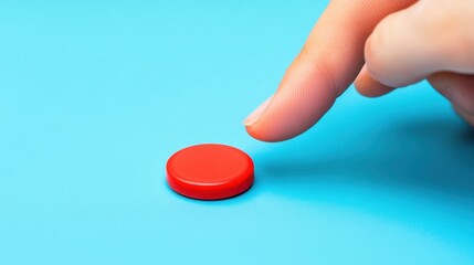 Poster - Hand Pointing Finger at Red Circular Object on Blue Background