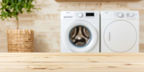 Empty wooden tabletop for display with blurred washing machine in laundry room background