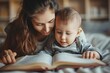 © Vera - Close-up Shot of Mother and Baby Boy Engrossed in a Picture Book, Capturing the Special Bond between Them