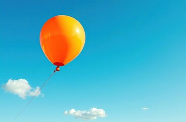 Wall Mural - An orange balloon drifts against a vibrant blue sky, symbolizing joy, freedom, and the lightness of being