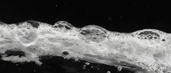 Poster - Bubbles with water droplets glistening against a dark background create a striking texture