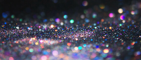 Poster - Glitter particles create a stunning texture against a dark background in vibrant colors