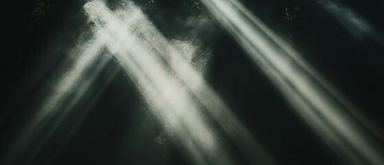 Poster - Light beams interacting with smoke create dramatic atmosphere against a black background