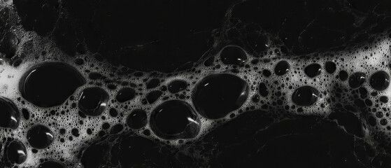 Poster - Liquid bubbles creating a smooth and dense texture against a black background