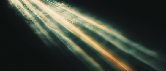 Poster - Bright sunbeams streaming through a warm atmosphere against a black background