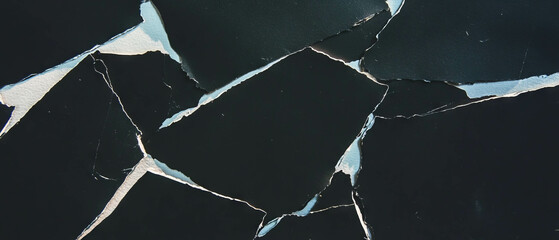 Poster - Torn edges paper texture with distressed look over black background for creative design