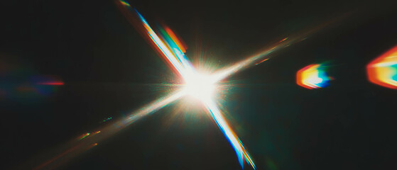 Poster - Vintage lens flare effect overlay with space for logo on black background