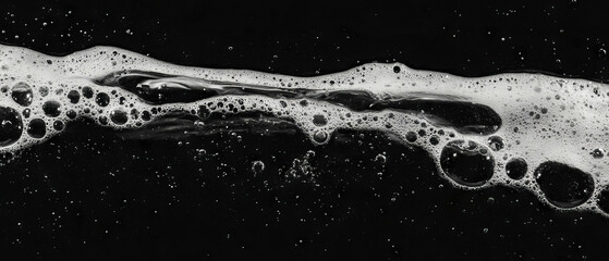 Poster - Fizzy water bubbles creating an effervescent texture against a dark background