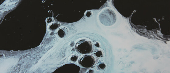 Poster - Water bubbles trapped in ice with a frozen effect against a black background
