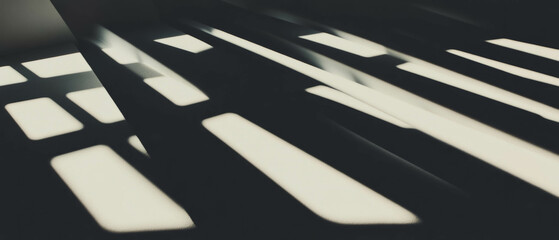 Poster - Shadows cast by window frames create geometric patterns on a black background