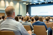 © Robert Kneschke - Audience Watching Speaker in a Modern Conference Hall Background