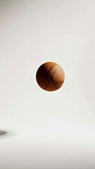 Poster - Classic leather basketball floating in the air on a minimalist white background, casting a subtle shadow, creating a striking visual with themes of levitation, sport, and potential energy