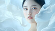 © seira_hibino - 美肌の若くて綺麗なアジア人女性モデルの美容・ファッションポートレート。白い布が舞う撮影背景。