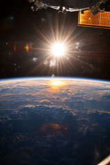 Poster - Earth's horizon from space illuminated by the rising sun, with a satellite and solar panels visible, symbolizing exploration, innovation, and the beauty of our planet.