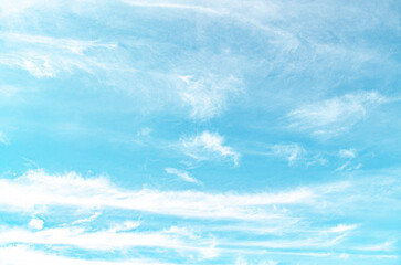 Wall Mural - clear blue sky with a few clouds. The sky is very bright and the clouds are scattered throughout
