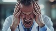 © The 2R Artificiality - Stressed male doctor in white coat expressing anxiety and frustration in healthcare setting close up portrait.