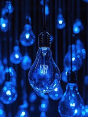Poster - Glowing blue light bulbs hanging in dark space creating a moody and modern abstract scene