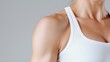 © BROPRADANA - Woman's muscular shoulder, fitness, studio, grey background, health
