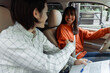 © Maria Vitkovska - Driving instructor shaking hands with student after successful driving test