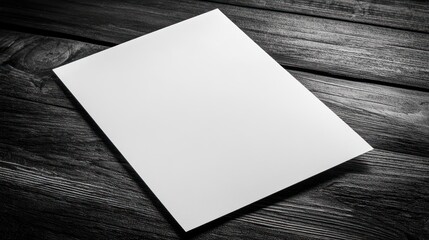 Blank White Paper on Dark Wooden Surface