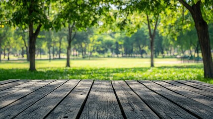 Poster - weathered gray wooden wall in an old park featuring a serene green landscape with lush trees and an 
