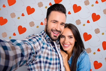 Poster - Self portrait of young, caucasian, attractive, lovely, cute, cheerful, positive, couple in shirts, man making selfie with his wonderful woman on mobile phone over grey background