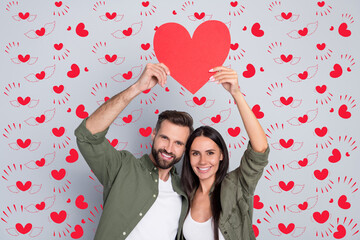 Poster - Portrait of attractive cheerful couple hugging holding heart card shape form cupid isolated over grey pastel color background