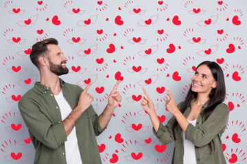 Poster - Portrait of attractive cheerful couple demonstrating copy space advert ad solution isolated over grey pastel color background