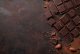 Rich dark chocolate with cocoa beans and crumbs on rustic textured background, perfect for confectionery, desserts, and gourmet recipes