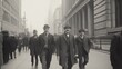© musa - Three men in suits walk down a busy city street in a vintage black and white photo.