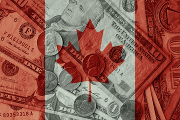 Canvas Print - colourful flag of canada on a dollar money banknotes and coins background. finance concept. macro shot