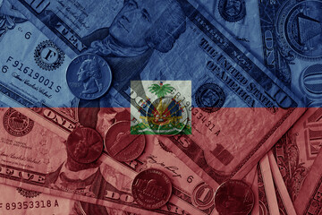 Canvas Print - colourful flag of haiti on a dollar money banknotes and coins background. finance concept. macro shot