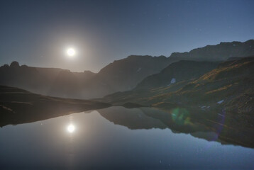 Wall Mural - moonlit night over a mountain lake