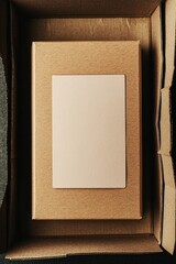 Poster - Open cardboard box with blank card inside for branding mockup