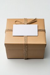 Poster - Cardboard box tied with string with blank gift tag sitting on white background