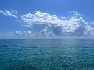 Wall Mural - ocean calm water and cloudy heaven horizon.