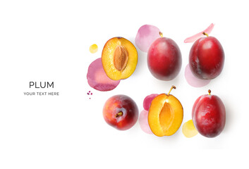 Wall Mural - Creative layout made of plums and watercolor spots on the background. Flat lay. Food concept. Lemon on white background.