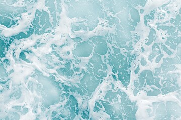 Poster - Turquoise sea water with foam and bubbles creating a relaxing texture, perfect for backgrounds and designs related to ocean, nature, and tranquility
