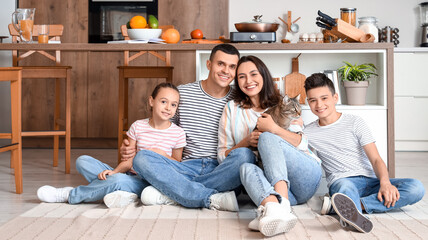 Wall Mural - Happy family with cat sitting in kitchen