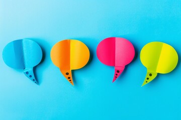 Aufkleber - Speech bubbles in four vibrant colors on a blue background, ideal for conveying ideas and social media themes