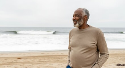 Wall Mural - Man is standing on the beach with a smile on his face