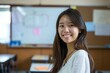 © CojanAI - Portrait of a young smiling Asian female teacher